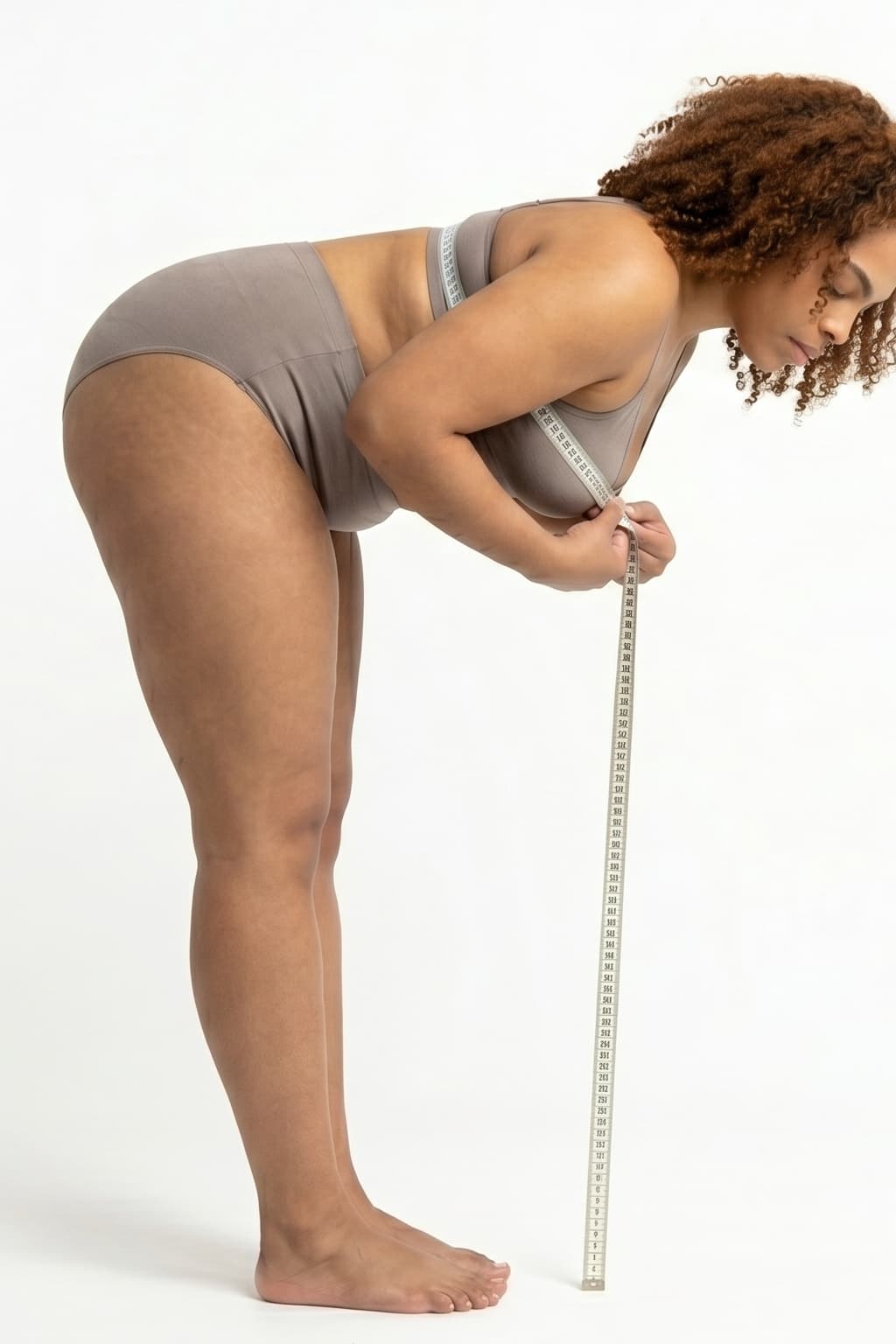 Woman measuring leaning bust